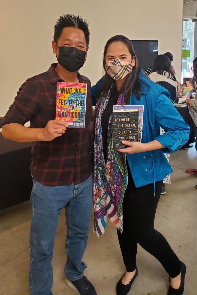 Talia and Pete Hsu hold copies of each other's books